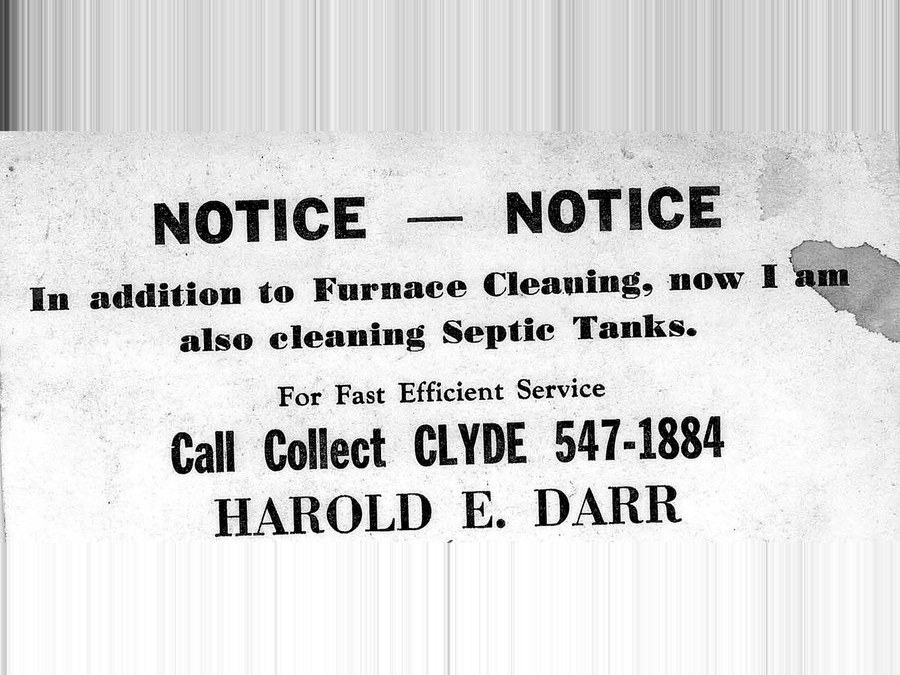 A printed notice reading: in addition to Furnace Cleaning, now I am also cleaning septic tanks