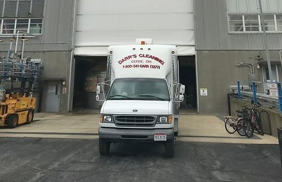 A Darr's Cleaning camera and inspection unit parked at a commercial facility