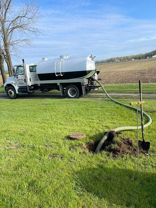 Vacuum tanker pumping a septic tank