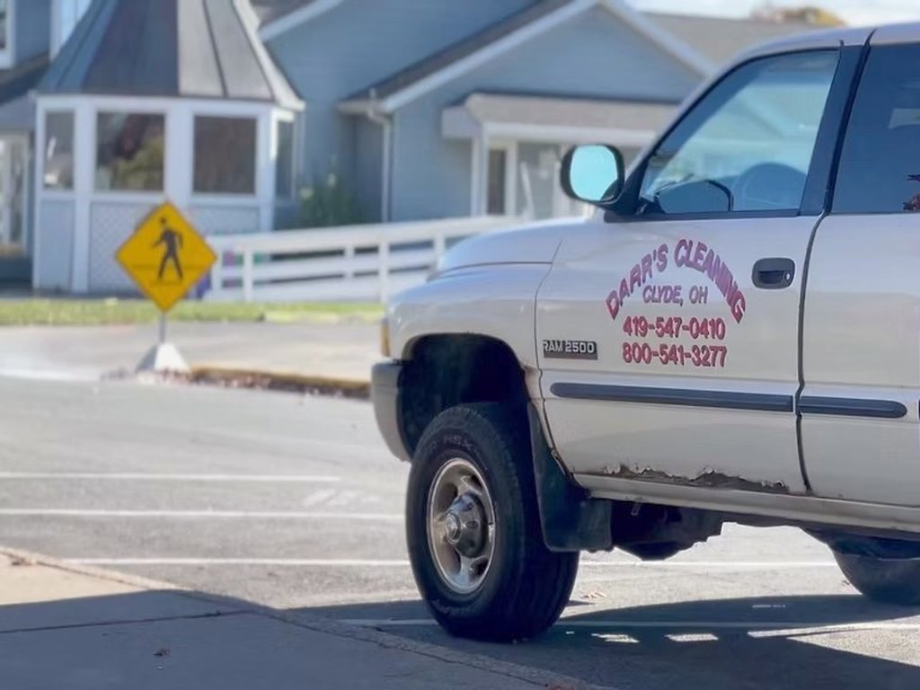 A Darr's truck on a residential street during a sewer smoke test